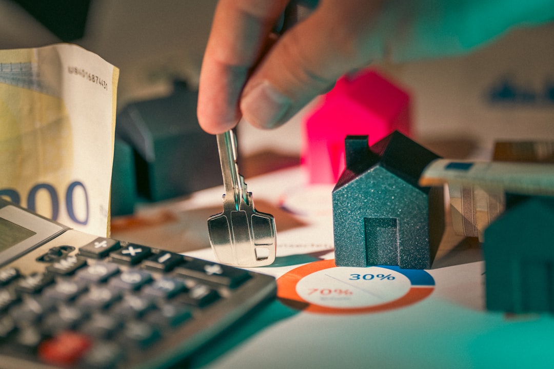 Services Housing investment financing prices. Hand holding key to new house door .